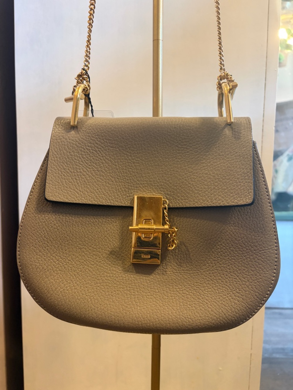 Chloe Drew crafted Pebbled taupe Leather Chain Crossbody Bag with Gold Lock